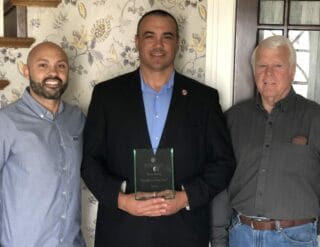 New Beginnings’ SSVF Program Coordinator, Victor Virgen, with Landlord of the Year, Steve Baird, and property owner of Camp Flores, Fred Pratt