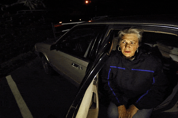 Safe Parking Program Woman Client Looks at the Camera while sitting in her vehicle