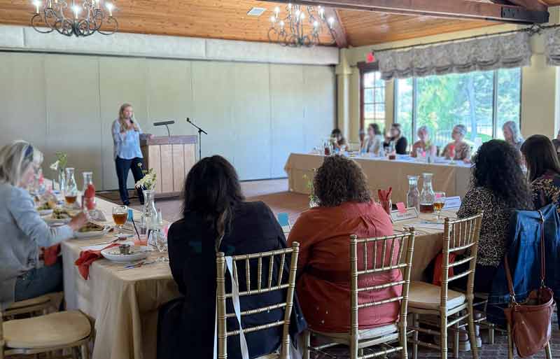 Luncheon_image_3 Woman speaking at podium during ladies luncheon event